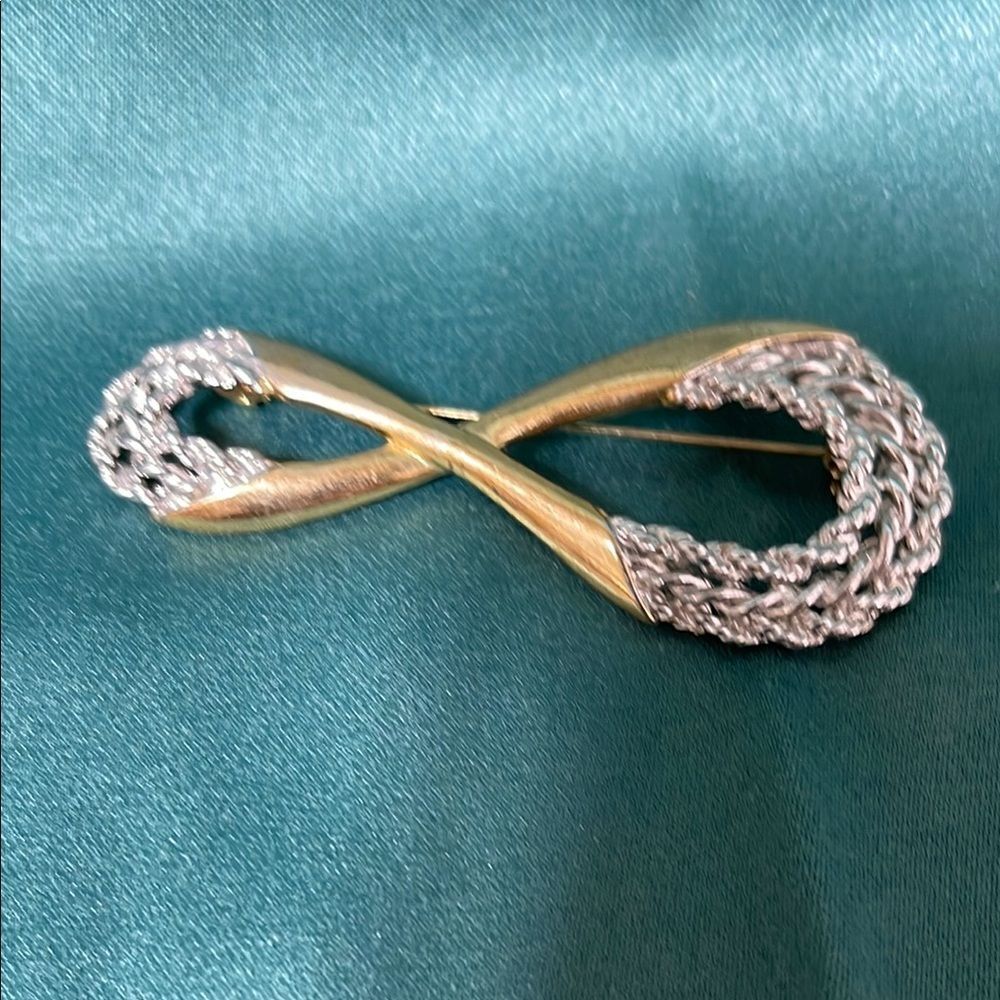 Elegant Gold and Silver Infinity Brooch